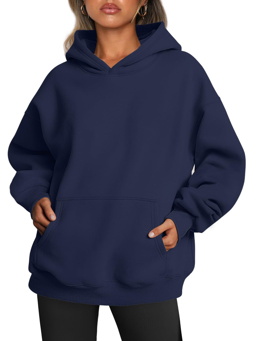 Women's hoodie styled with the hood up, showing the relaxed oversized drape