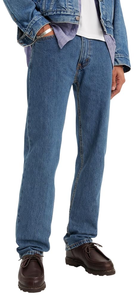 Men's 505 regular fit jeans in mid-blue denim, angled view highlighting the regular fit through the thigh