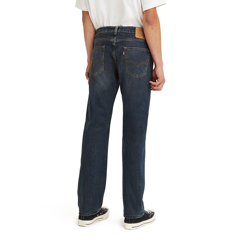 Men's 505 regular fit jeans in blue denim, angled close-up of the front rise and seams