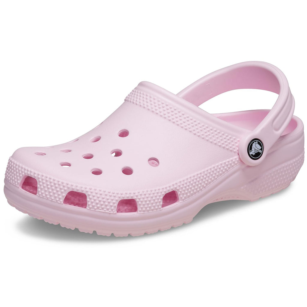 Clog pictured at a three-quarter angle, showing the strap, rivet and perforated upper