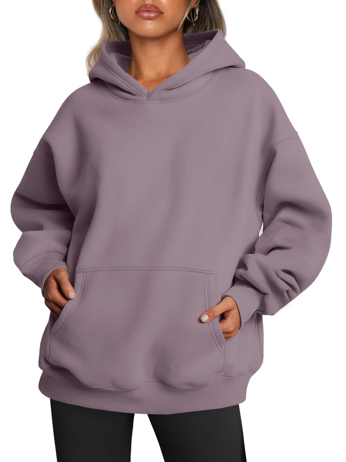 Women's hoodie shown with sleeves pushed up, revealing the oversized cut