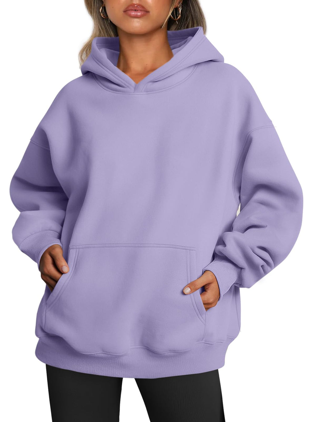 Women's oversized hoodie in motion, showing loose drape and comfortable fit