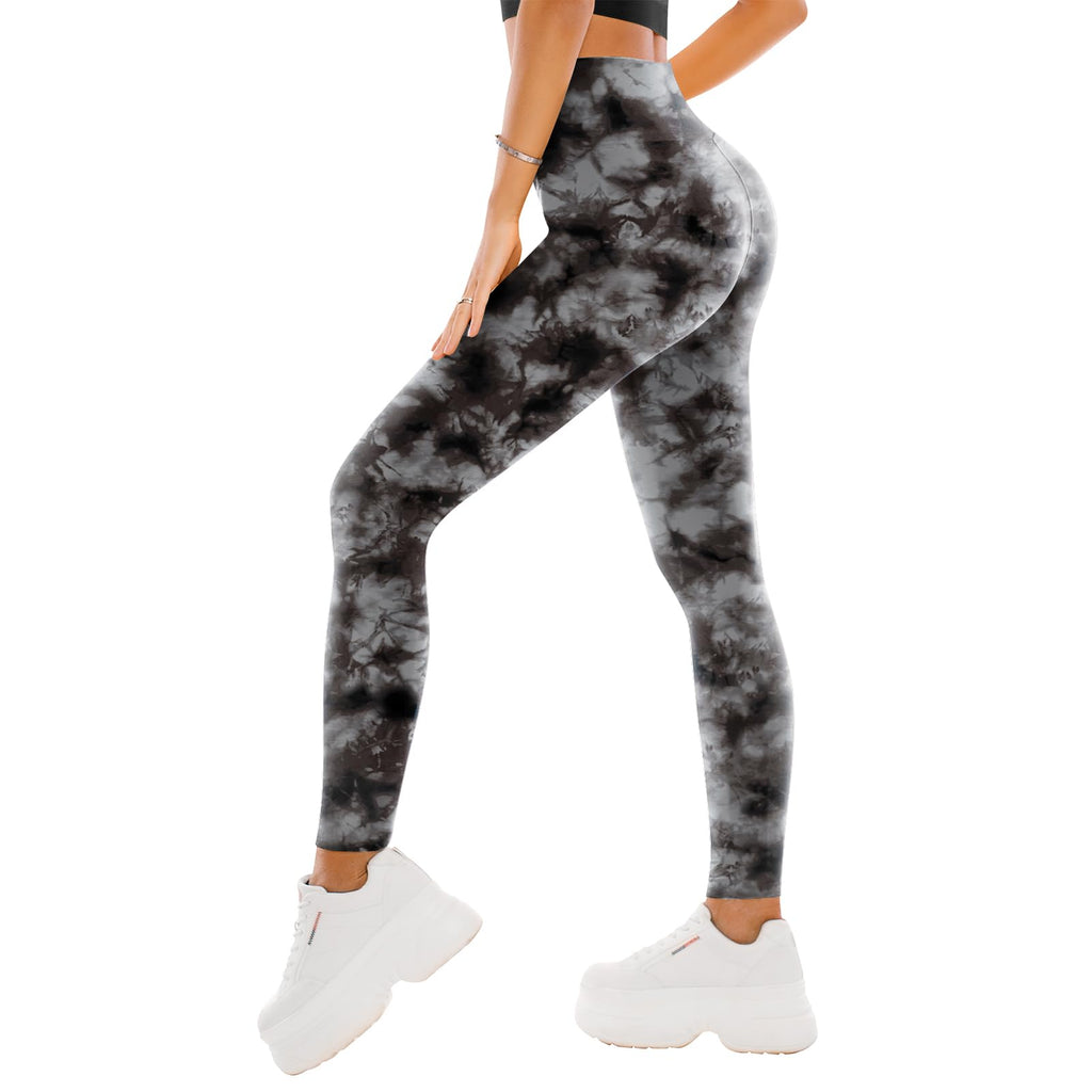 Model wearing high waisted black leggings in a standing pose, showing the full-length fit at the ankle