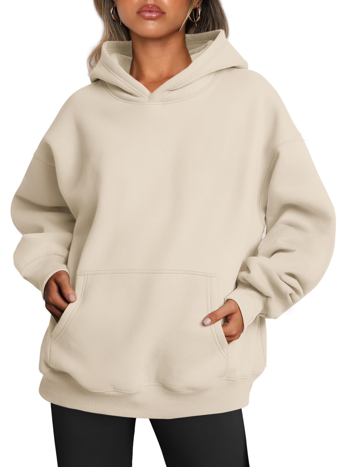 Oversized women's hoodie in front view showing relaxed fit and drawstring hood