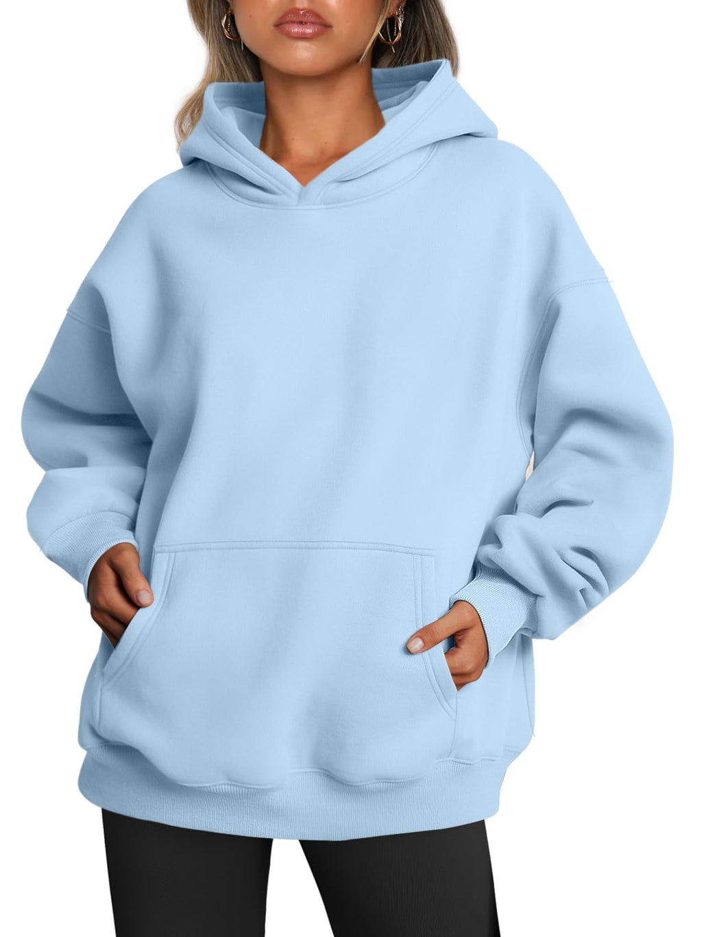 Close-up of the hoodie's drawstring hood and ribbed cuffs on the women's sweatshirt