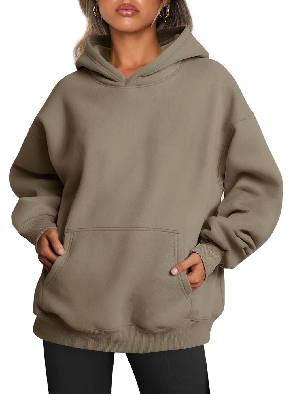 Women's hoodie folded flat showing fabric drape and oversized proportions
