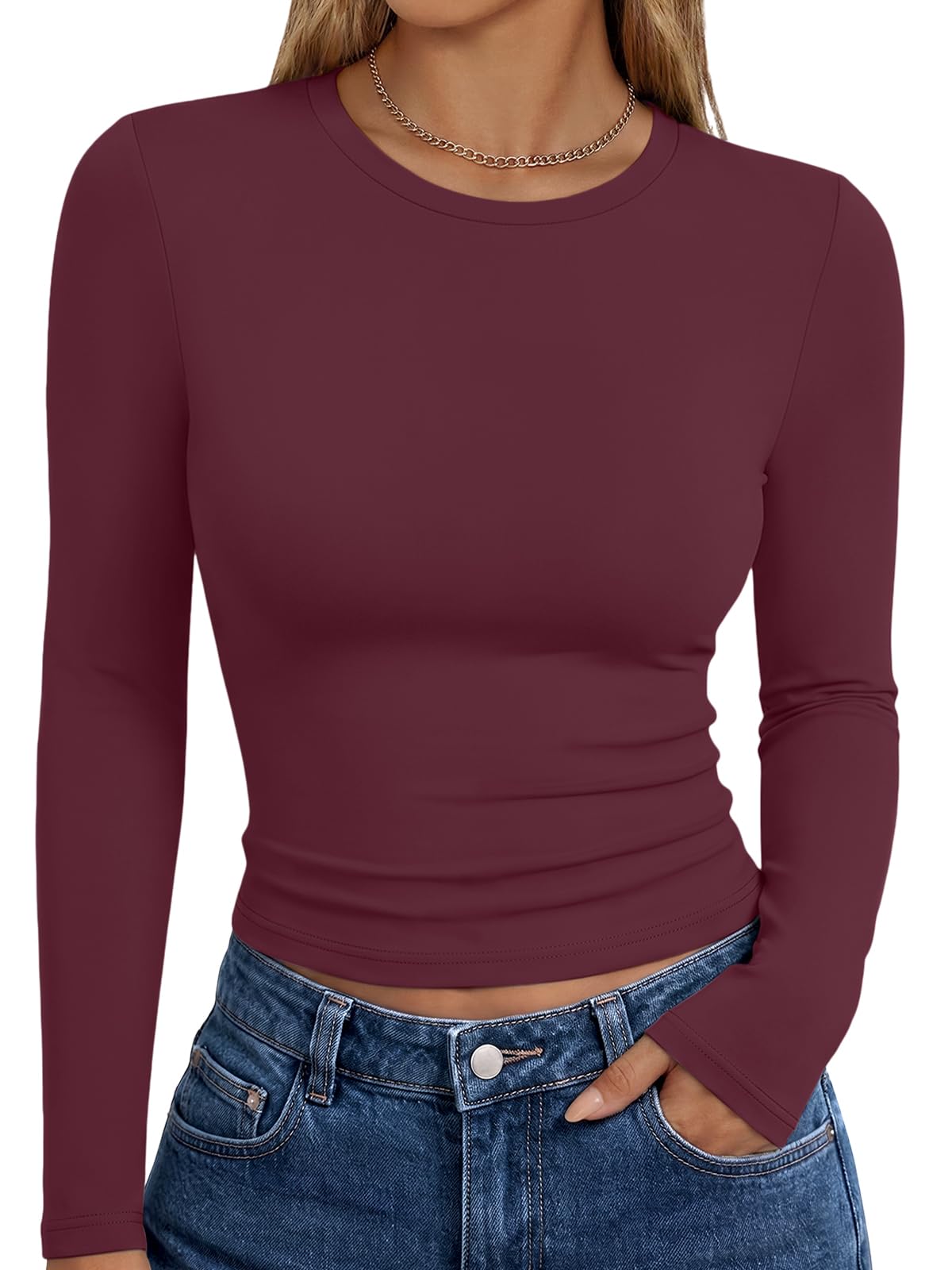Model in the long sleeve Y2K top with arms slightly raised to show sleeve movement