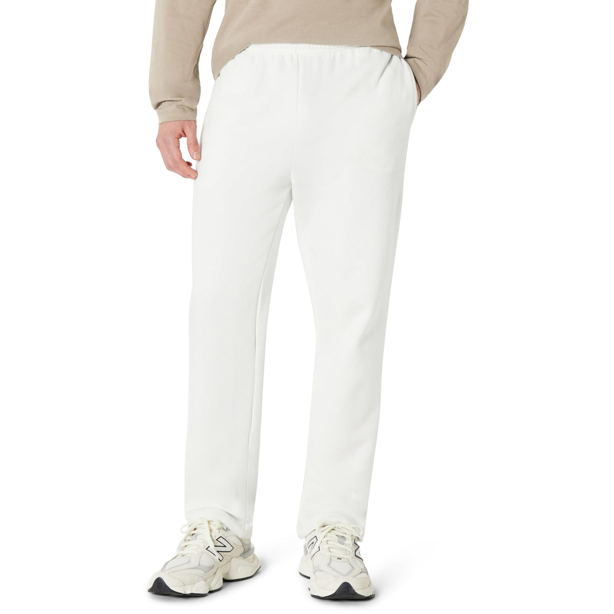 Men's open bottom fleece sweatpants in light grey, styled full length outdoors