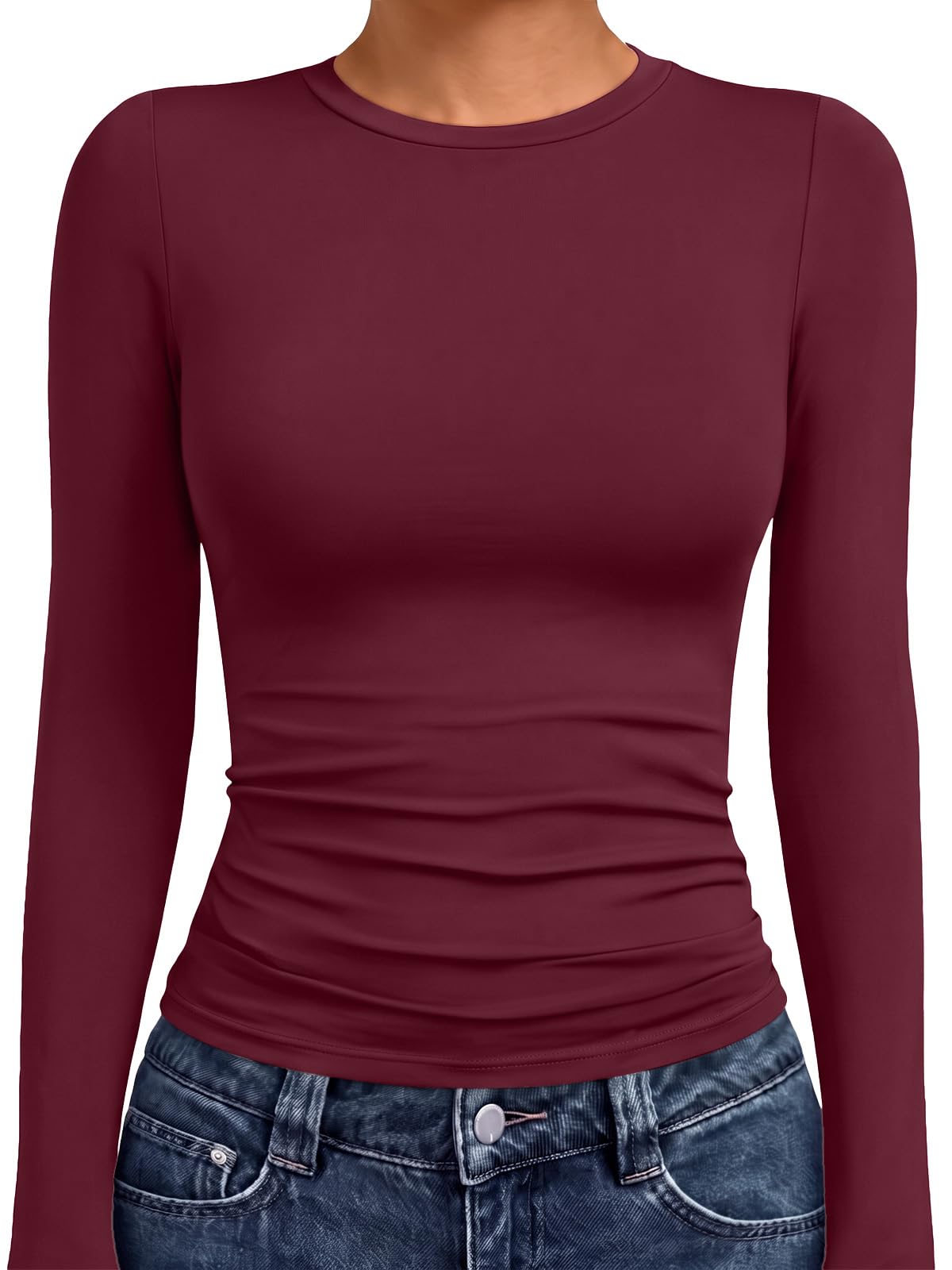 Women's crew neck compression top shown in a seated pose