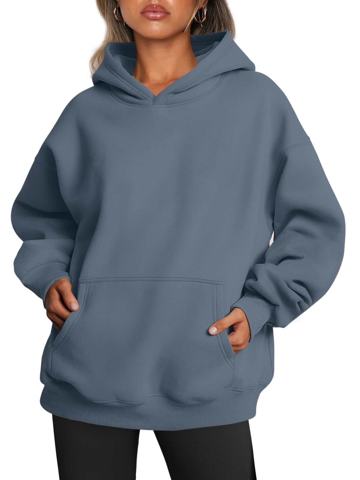 Women's oversized hoodie worn with jeans, styled casual outfit front view