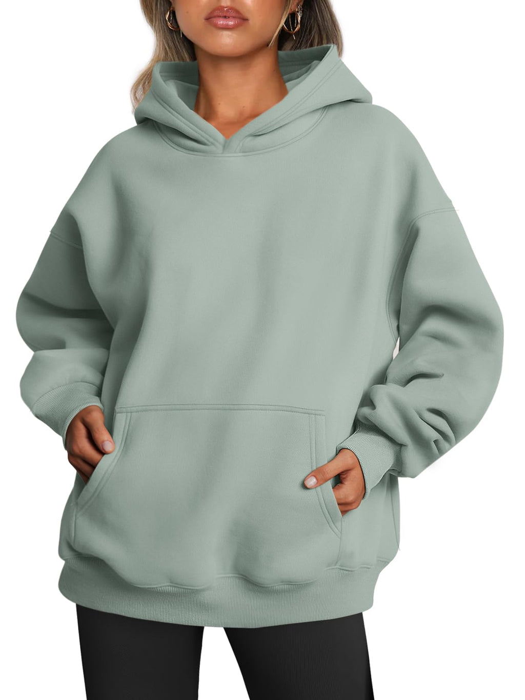 Model wearing the oversized hoodie with sleeves pushed up, relaxed everyday look