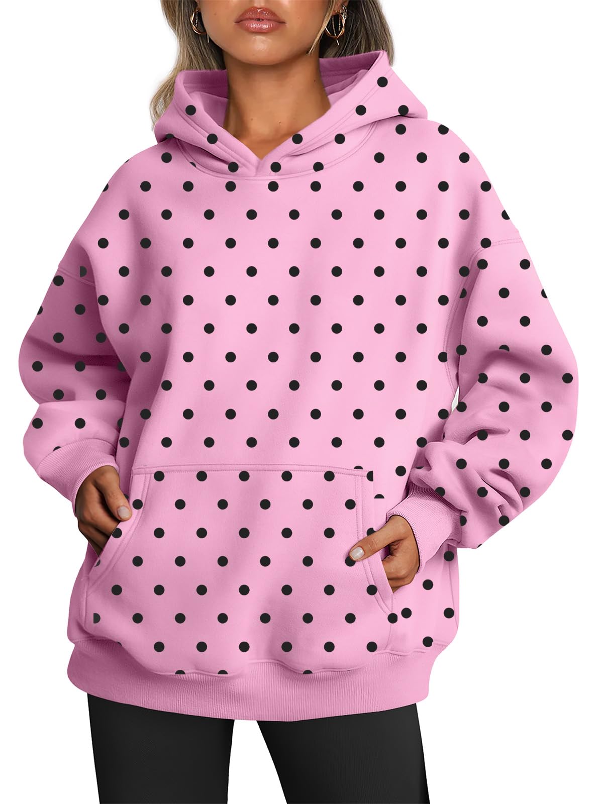 Hoodie photographed at an angle showing the front pocket and hood shape