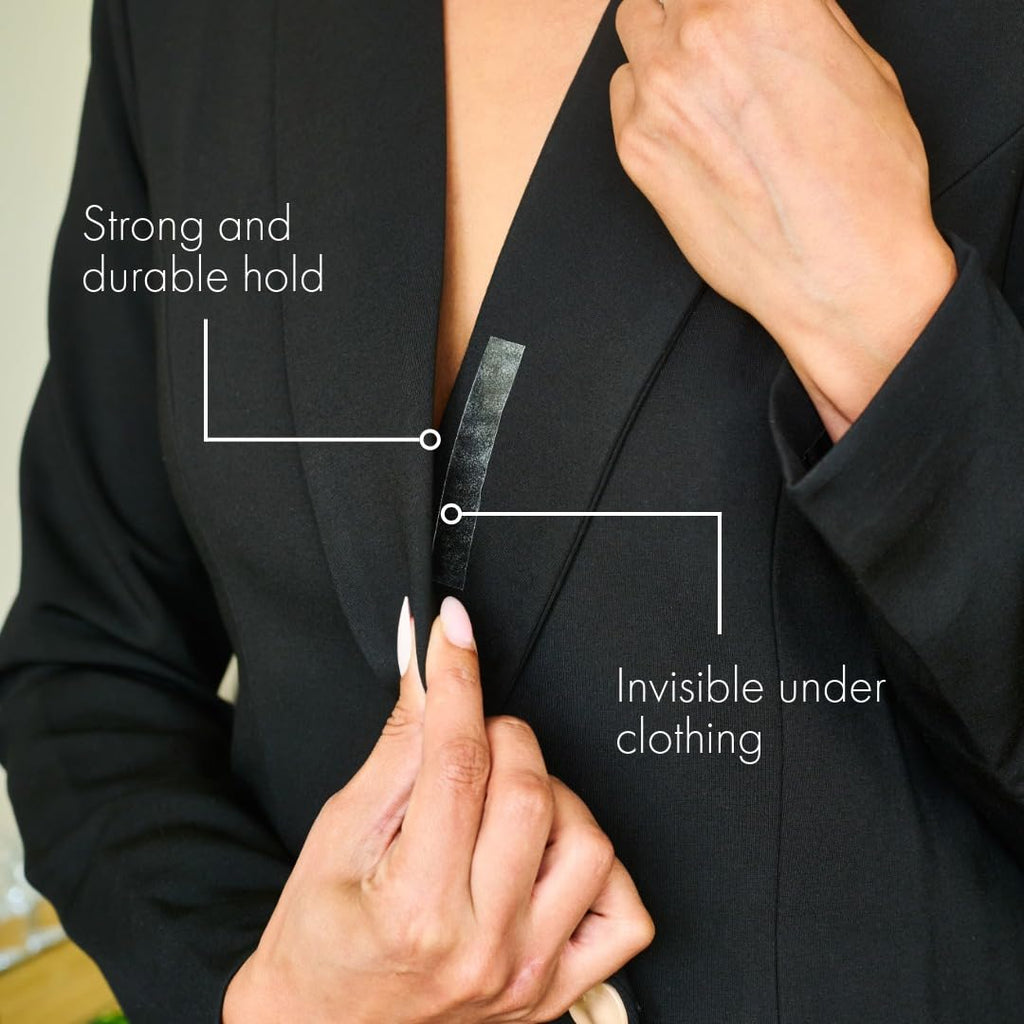 Fearless Tape fashion tape strip being smoothed onto clothing with a fingertip