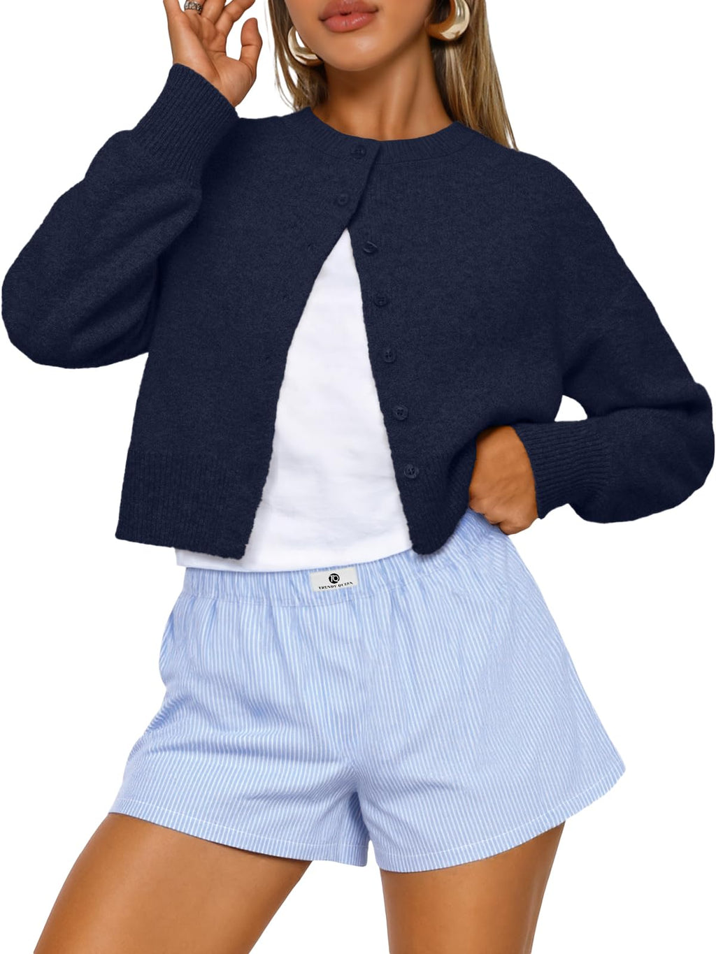 Full-length view of the cropped cardigan styled for autumn fashion