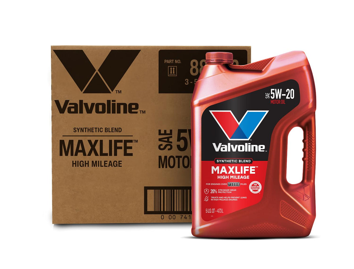 Motor oil jug and funnel ready for an at-home high mileage oil change