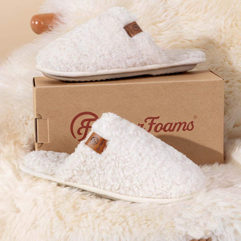 Women's fuzzy slippers in soft plush fabric, shown from the front as a cozy indoor house shoe