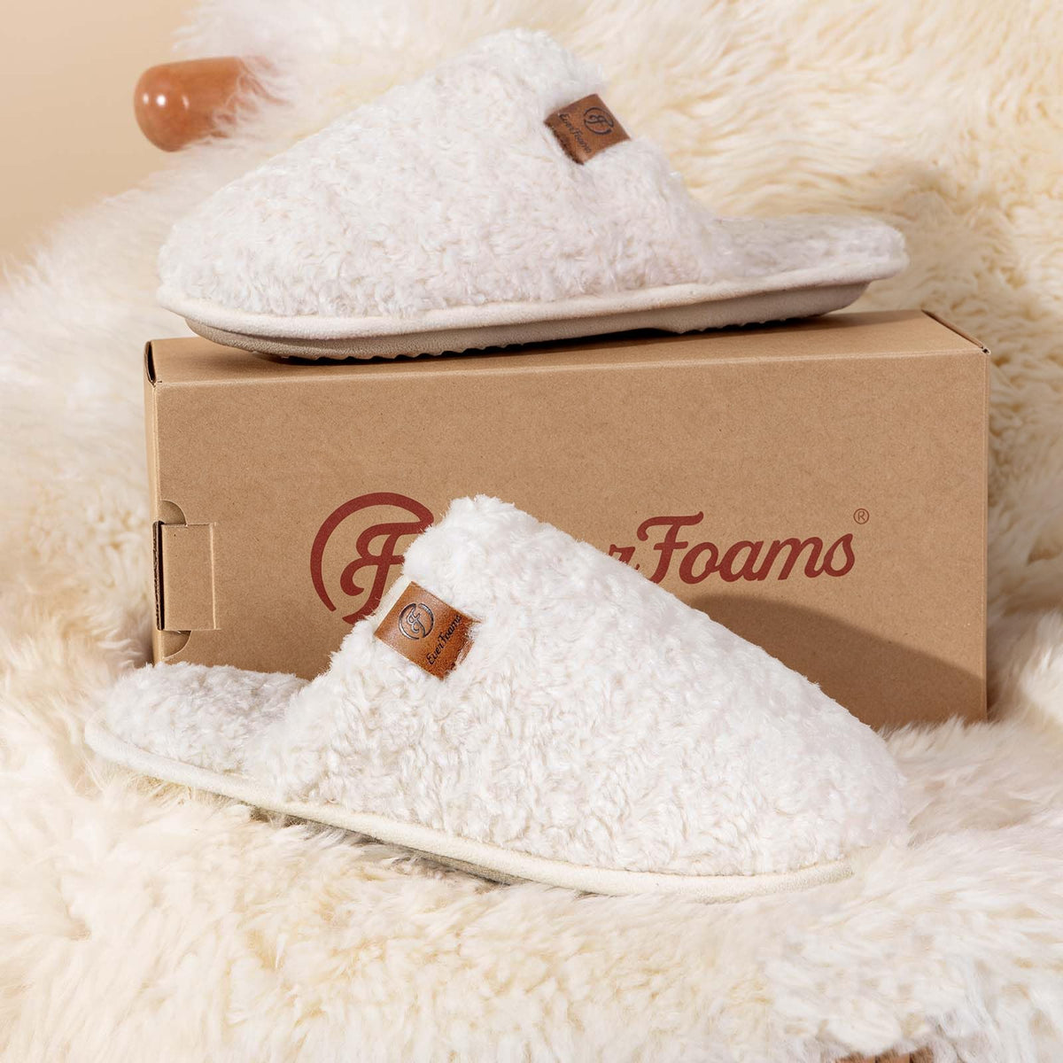 Women's fuzzy slippers in soft plush fabric, shown from the front as a cozy indoor house shoe