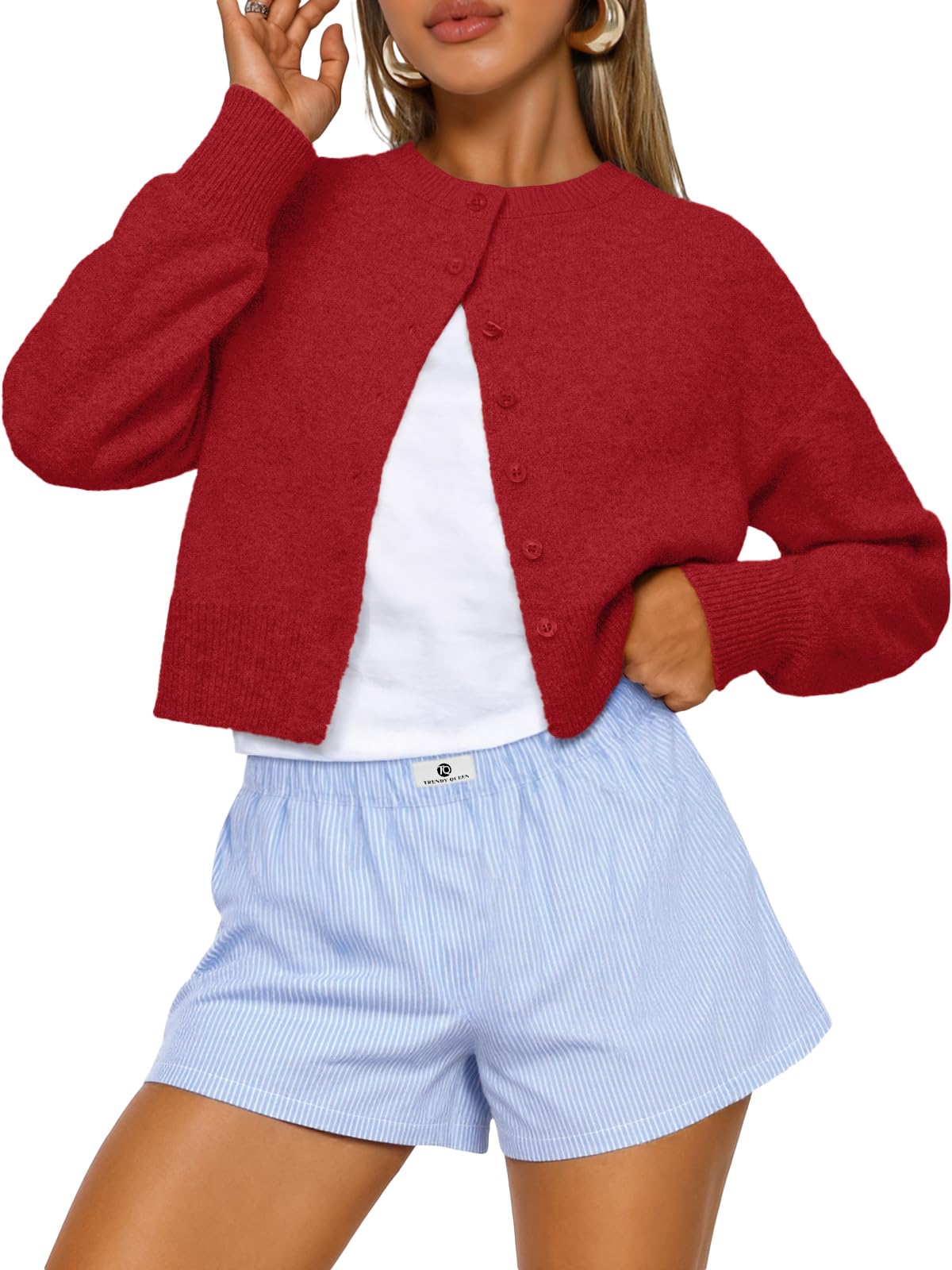 Cropped cardigan buttoned up, styled as a fall layering piece