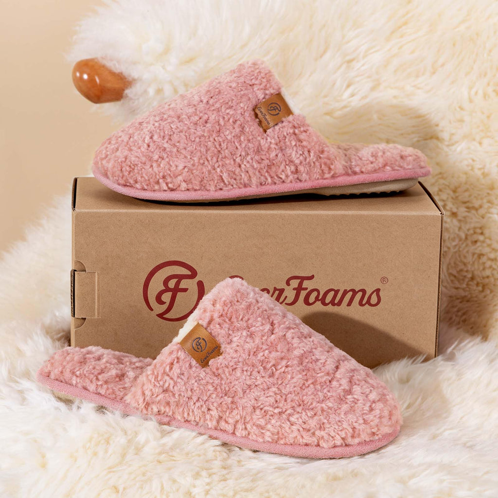 Pair of women's cozy fuzzy slippers with fluffy lining, front-facing view