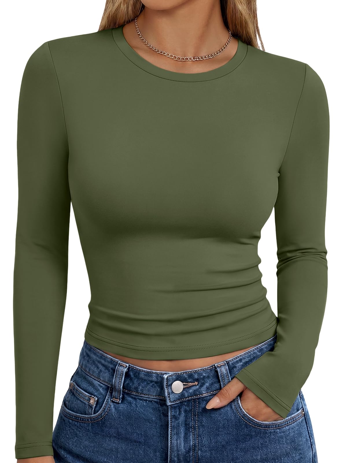 Detail of the crew neck and shoulder seams on the long sleeve women's top
