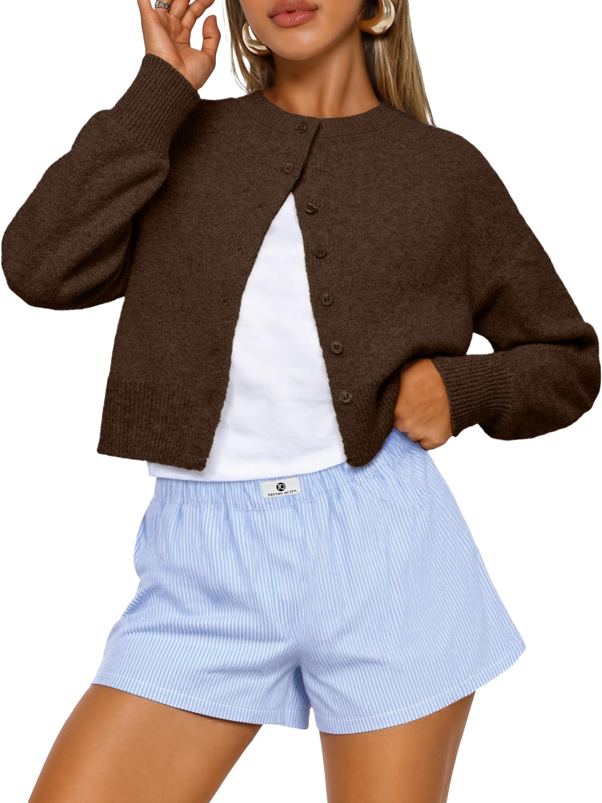 Full-length view of the cropped cardigan sweater on a standing model