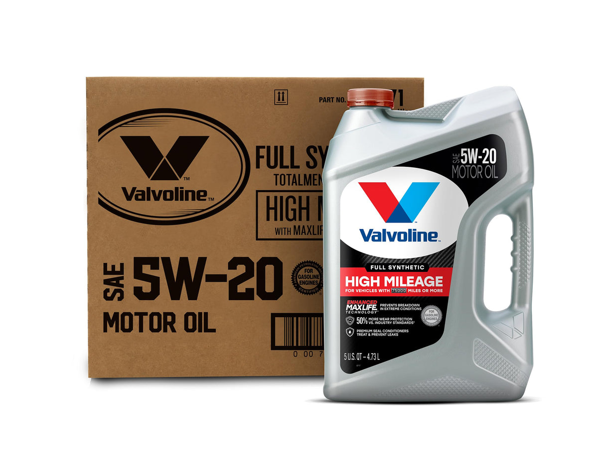 High mileage 5W-30 synthetic blend oil bottle next to funnel and drain pan