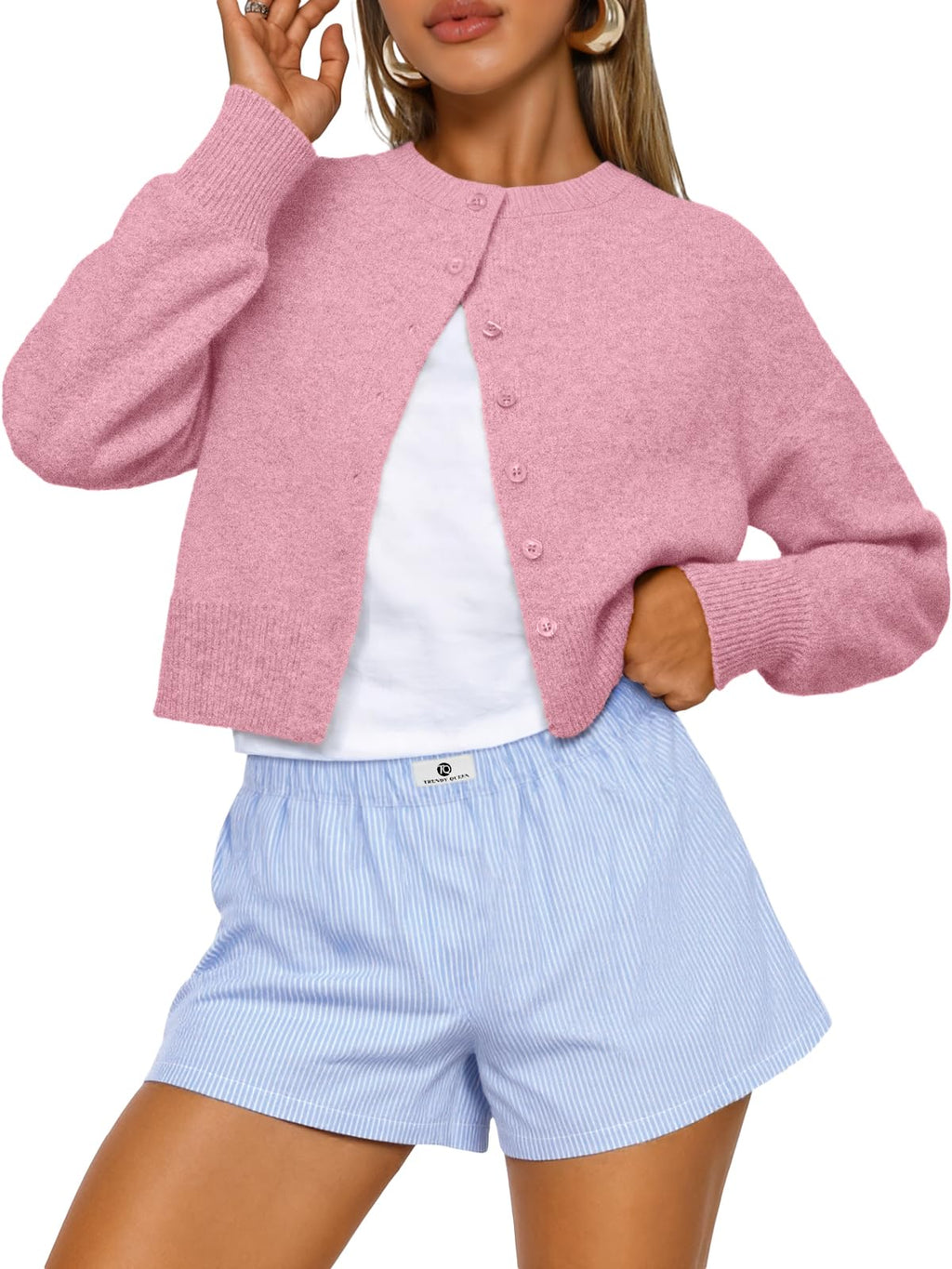 Detail shot of the cropped cardigan shoulder and sleeve seam