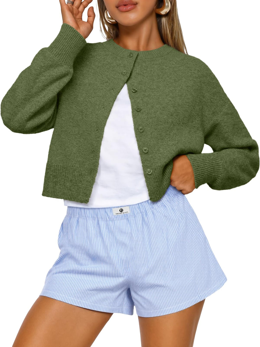 Women's cropped cardigan sweater in a relaxed pose showing the fit