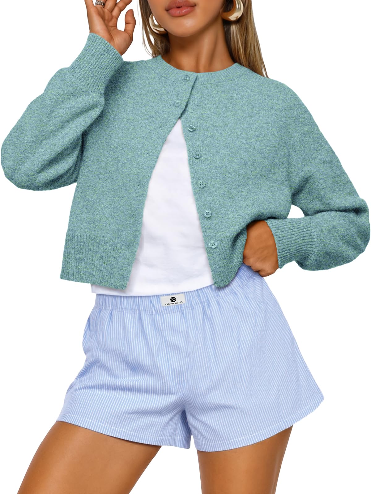 Cropped cardigan sweater for women shown buttoned up in a front view, fall fashion layering piece