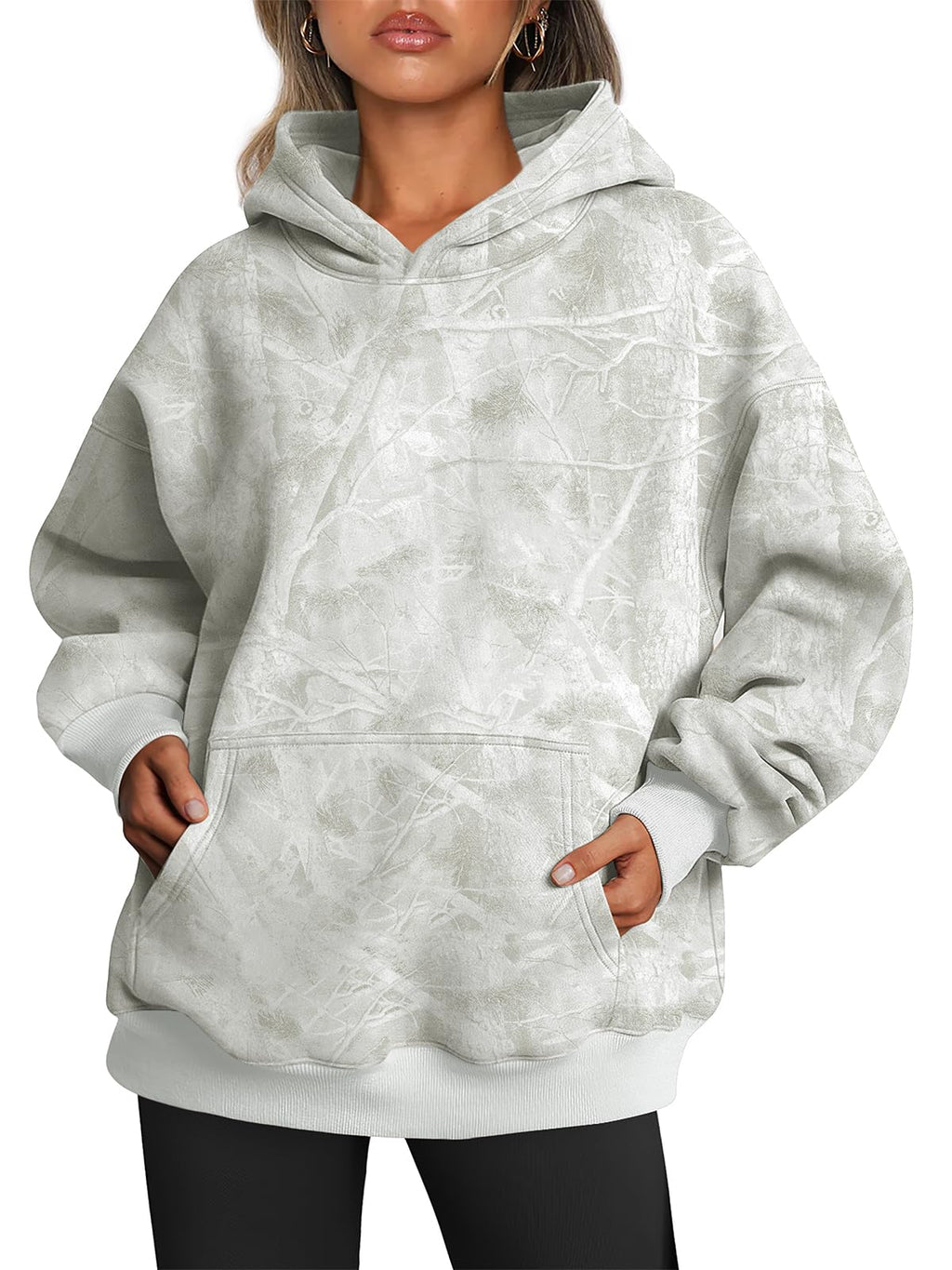Hoodie worn casually with the hood down, showing the oversized fit across the shoulders