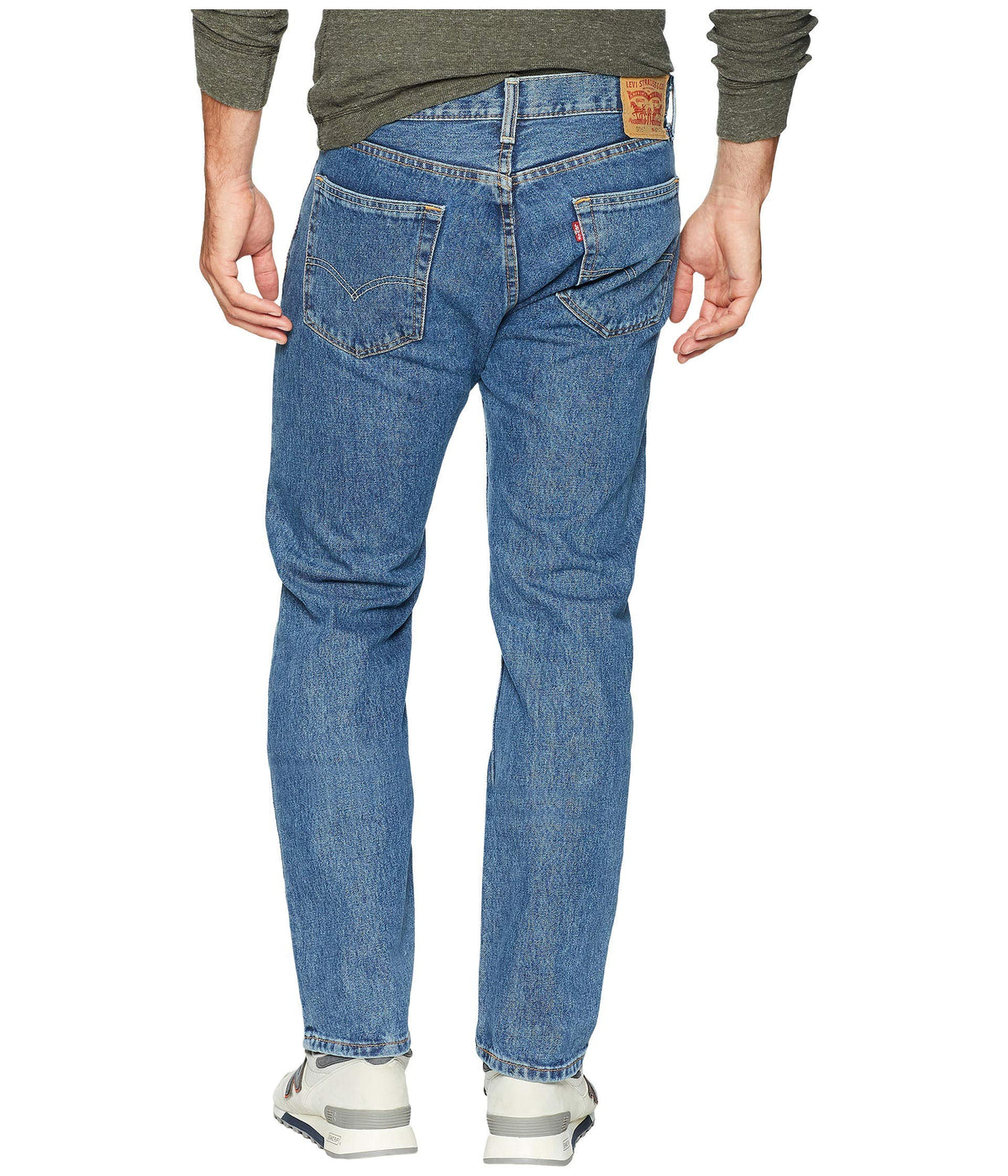 Side view of men's 505 regular fit jeans highlighting the regular rise and fit